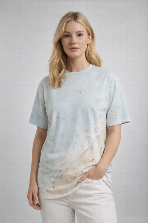 Woman wearing a light blue t-shirt with a beach design on a white background