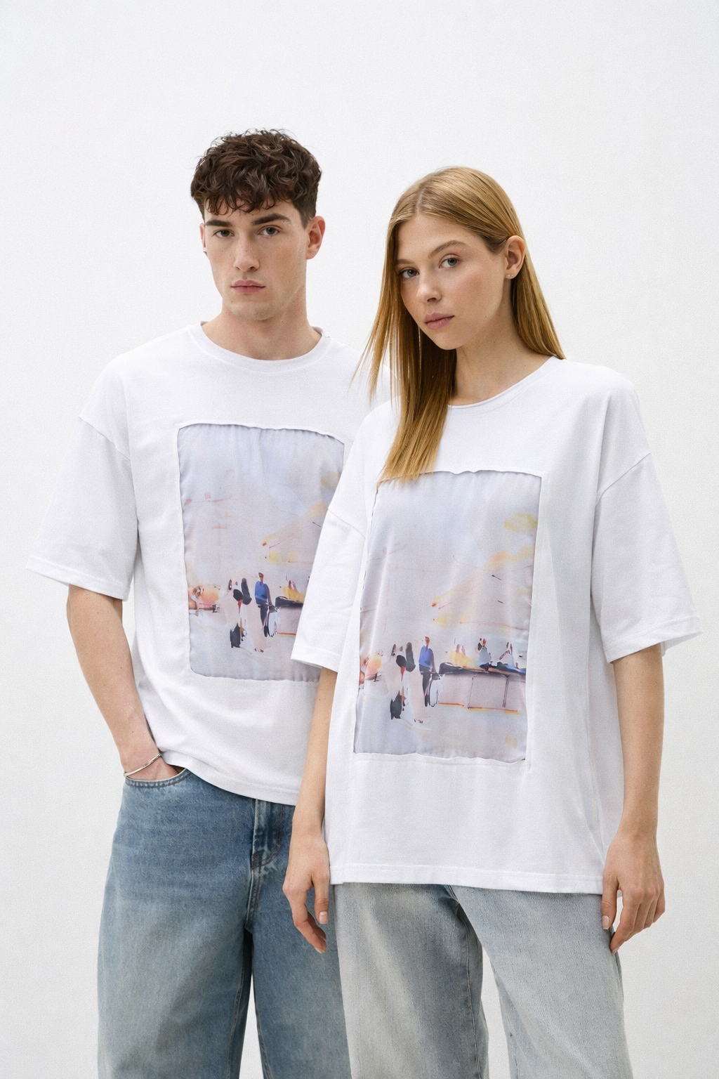 Two people wearing white t-shirts with printed designs on a plain background